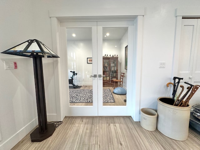 113 Mission Bay Dr, Polson, MT 59860 - doorway featuring french doors, wood finished floors, and baseboards