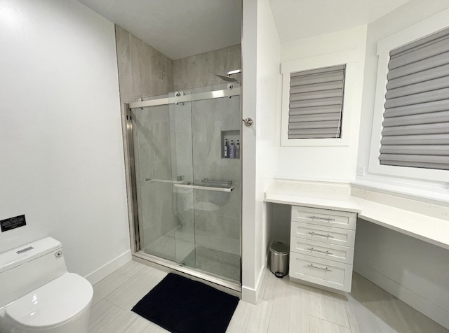 113 Mission Bay Dr, Polson, MT 59860 - bathroom with a shower stall, toilet, baseboards, and vanity