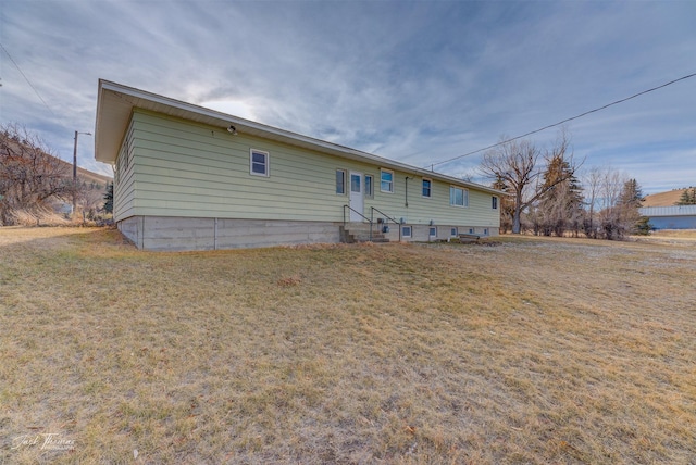 4212 W US Highway 12, Helena, MT 59601 - rear view of house with a yard