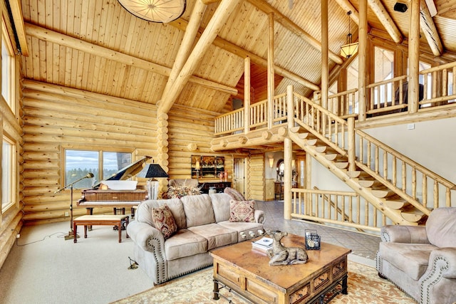 1130 Hegson Dr, Stevensville, MT 59870 - living room featuring high vaulted ceiling, wood ceiling with exposed beams, log walls, and stairs