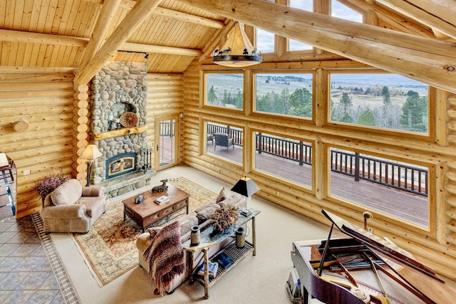 1130 Hegson Dr, Stevensville, MT 59870 - living area with log walls, wooden ceiling with exposed beams, plenty of natural light, a stone fireplace, and high vaulted ceiling