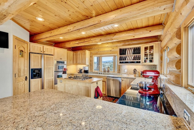 1130 Hegson Dr, Stevensville, MT 59870 - kitchen with stainless steel appliances, light brown cabinets, a sink, log walls, and recessed lighting