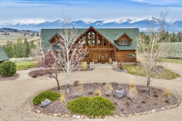 1130 Hegson Dr, Stevensville, MT 59870 - log home with covered porch, log siding, and a mountain view