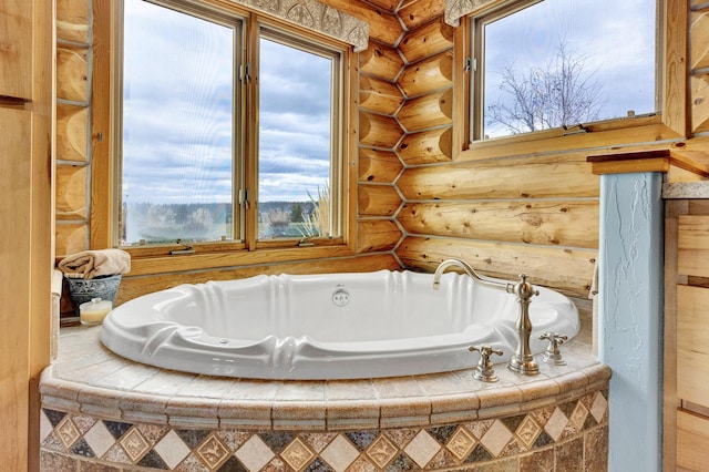 1130 Hegson Dr, Stevensville, MT 59870 - bathroom featuring log walls, a bath, and healthy amount of natural light