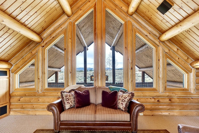 1130 Hegson Dr, Stevensville, MT 59870 - carpeted living area featuring rustic walls, wood ceiling, and a mountain view