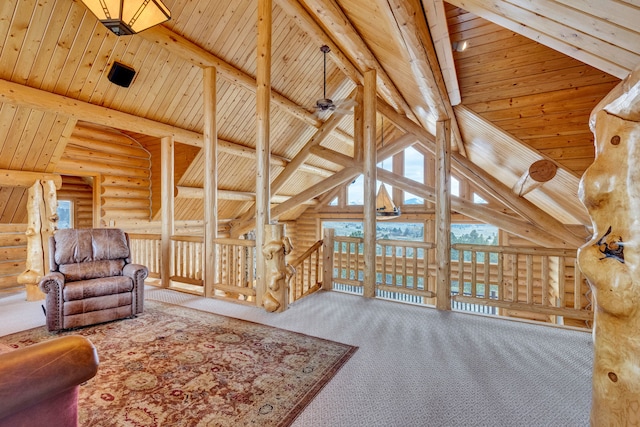 1130 Hegson Dr, Stevensville, MT 59870 - living room featuring log walls, wood ceiling, and carpet flooring