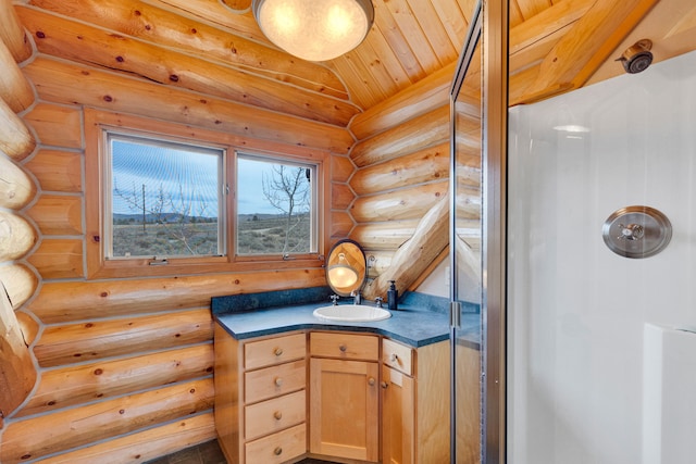 1130 Hegson Dr, Stevensville, MT 59870 - bathroom with log walls, vanity, a shower, and wood ceiling