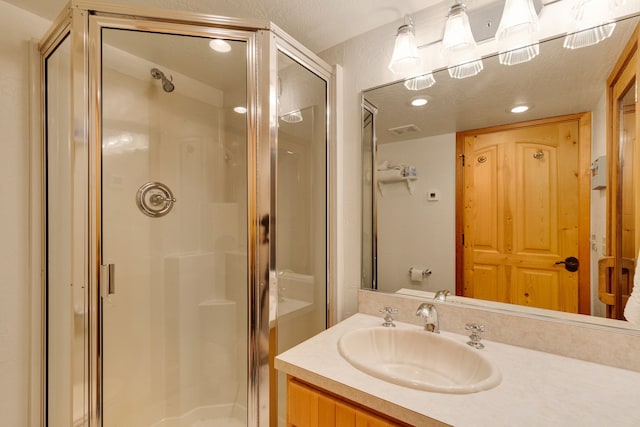 1130 Hegson Dr, Stevensville, MT 59870 - full bathroom featuring a shower stall, vanity, and recessed lighting