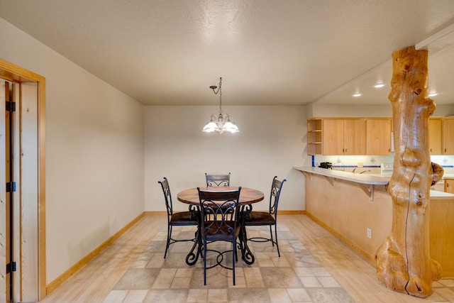 1130 Hegson Dr, Stevensville, MT 59870 - dining area with baseboards and a chandelier