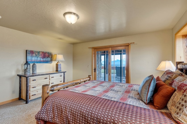 1130 Hegson Dr, Stevensville, MT 59870 - bedroom with access to exterior, light colored carpet, and baseboards