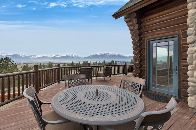 1130 Hegson Dr, Stevensville, MT 59870 - wooden deck with outdoor dining area and a mountain view