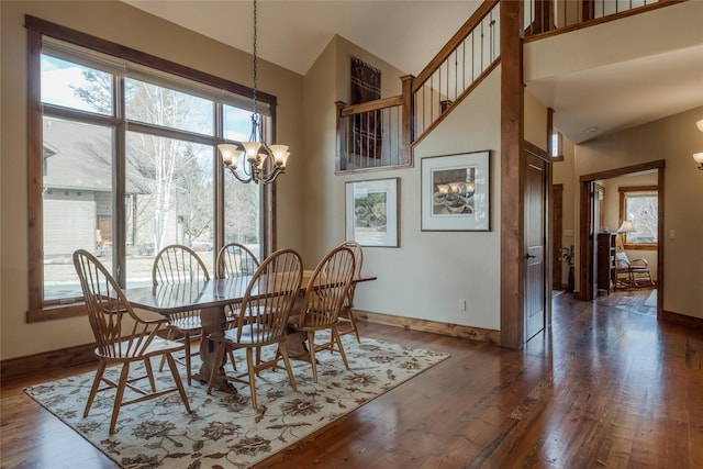 1 Rock Creek Ct, Whitefish, MT 59937 - dining area with a chandelier, healthy amount of natural light, baseboards, and a high ceiling