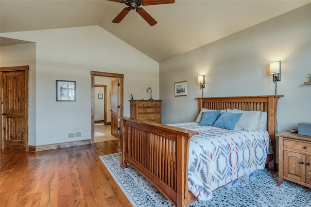 1 Rock Creek Ct, Whitefish, MT 59937 - bedroom with high vaulted ceiling, wood finished floors, ceiling fan, and baseboards