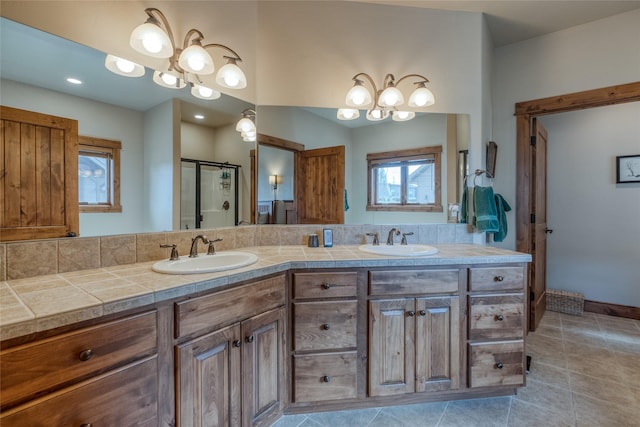 1 Rock Creek Ct, Whitefish, MT 59937 - bathroom featuring a shower stall, double vanity, and tile patterned flooring