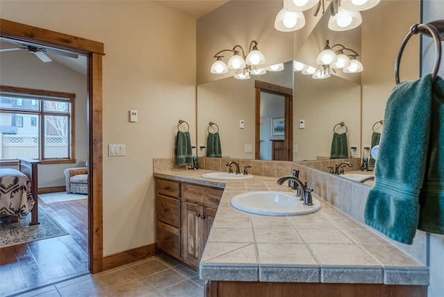 1 Rock Creek Ct, Whitefish, MT 59937 - ensuite bathroom featuring baseboards, a ceiling fan, and double vanity