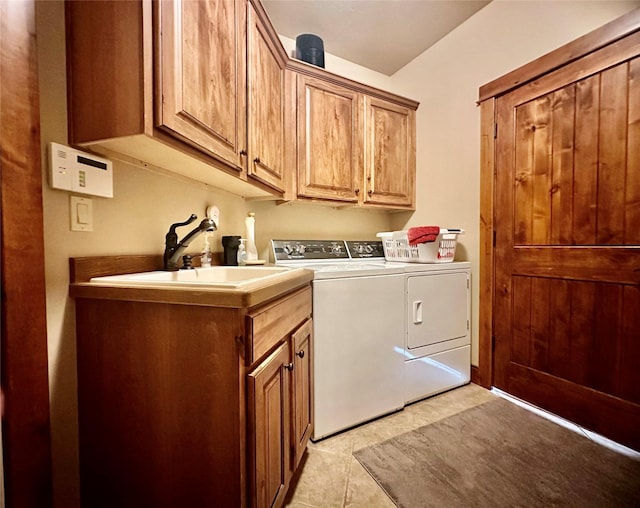 1 Rock Creek Ct, Whitefish, MT 59937 - laundry room featuring separate washer and dryer, cabinet space, and light tile patterned flooring