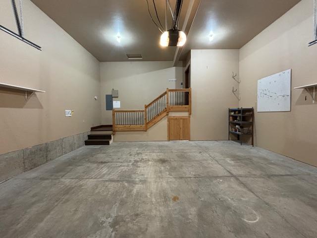 1 Rock Creek Ct, Whitefish, MT 59937 - garage featuring a garage door opener