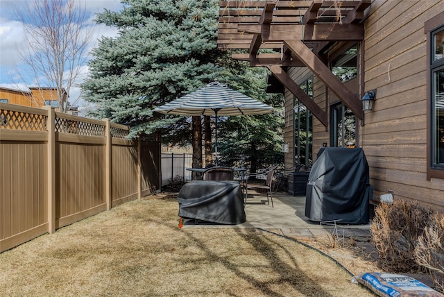 1 Rock Creek Ct, Whitefish, MT 59937 - view of patio featuring fence, grilling area, and a pergola