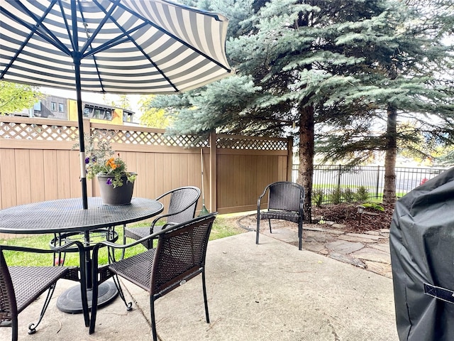 1 Rock Creek Ct, Whitefish, MT 59937 - view of patio / terrace featuring outdoor dining area and fence