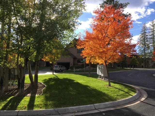 1 Rock Creek Ct, Whitefish, MT 59937 - view of front of property featuring a front lawn and a garage