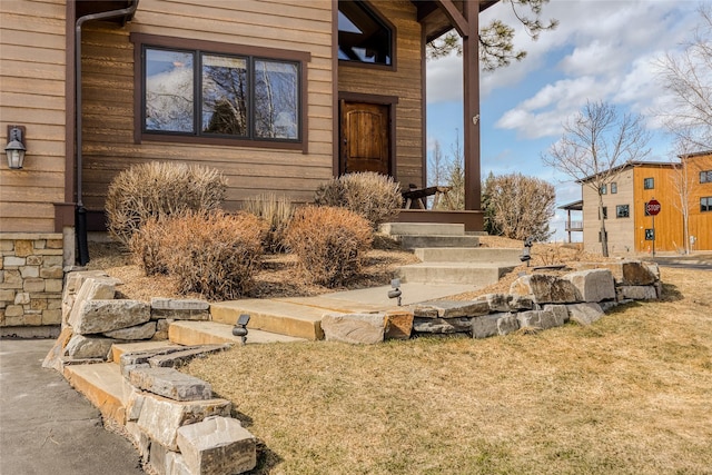 1 Rock Creek Ct, Whitefish, MT 59937 - view of exterior entry with a lawn