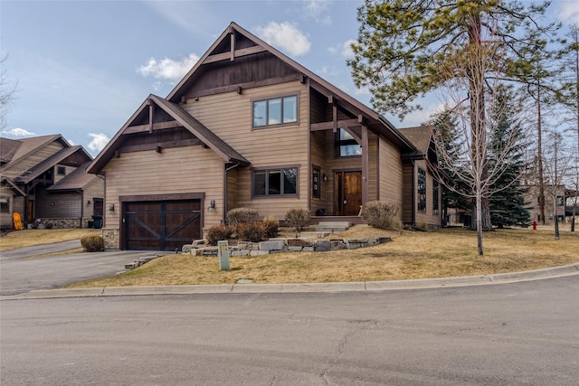 1 Rock Creek Ct, Whitefish, MT 59937 - craftsman house featuring driveway and a front yard