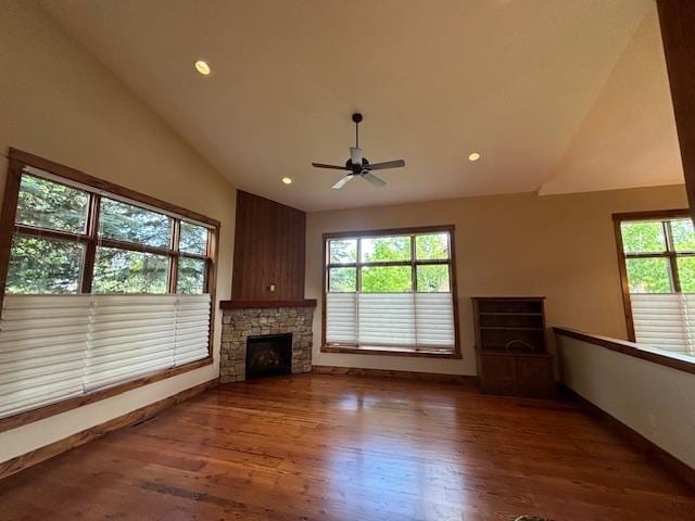 1 Rock Creek Ct, Whitefish, MT 59937 - unfurnished living room featuring healthy amount of natural light, wood finished floors, ceiling fan, recessed lighting, and a fireplace