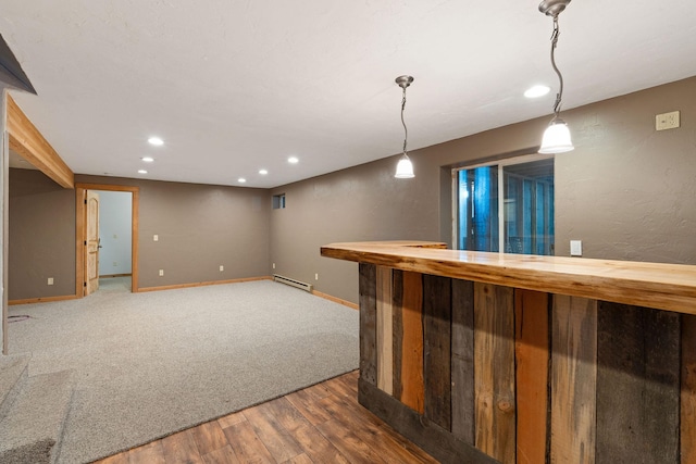 253 Aero Ln, Bigfork, MT 59911 - indoor dry bar featuring recessed lighting, wood finished floors, a baseboard heating unit, and hanging light fixtures