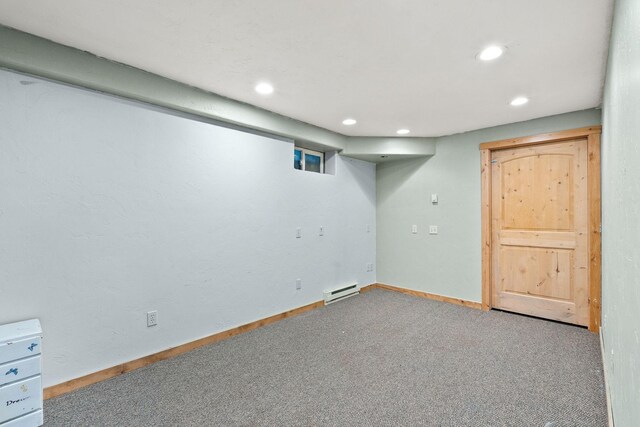 253 Aero Ln, Bigfork, MT 59911 - finished below grade area featuring a baseboard radiator, recessed lighting, and carpet