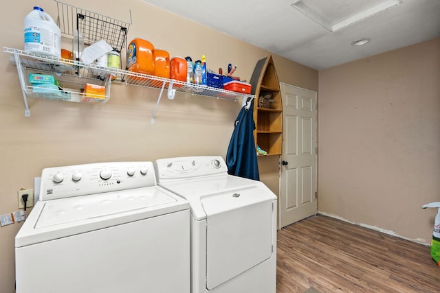 253 Aero Ln, Bigfork, MT 59911 - laundry room featuring washer and clothes dryer, attic access, and wood finished floors
