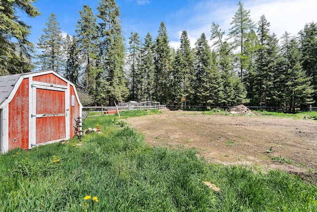 253 Aero Ln, Bigfork, MT 59911 - view of yard with a shed and a view of trees