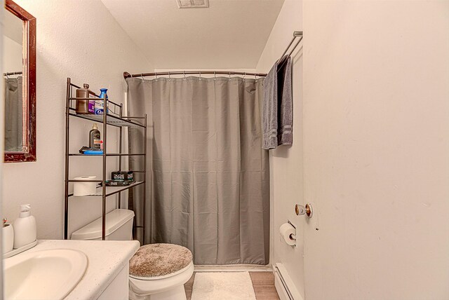 1312 Cole Ave, Helena, MT 59601 - bathroom with toilet, vanity, and a shower with shower curtain