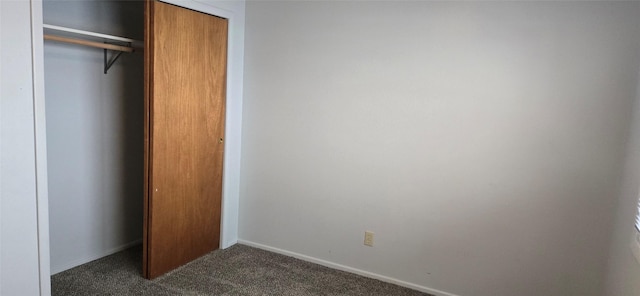 1318 Cole Ave, Helena, MT 59601 - unfurnished bedroom featuring dark carpet, a closet, and baseboards