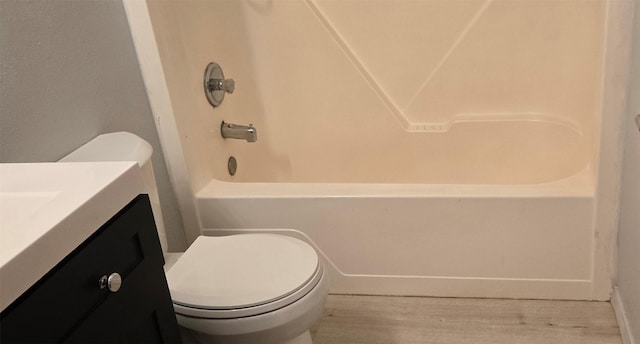 1318 Cole Ave, Helena, MT 59601 - bathroom featuring vanity, toilet, wood finished floors, and shower / washtub combination