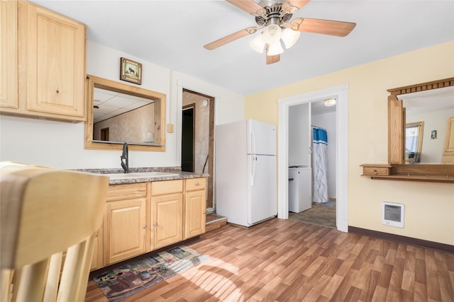 433 Swamp Creek Rd, Wise River, MT 59762 - kitchen featuring a sink, a ceiling fan, light wood finished floors, freestanding refrigerator, and light brown cabinets