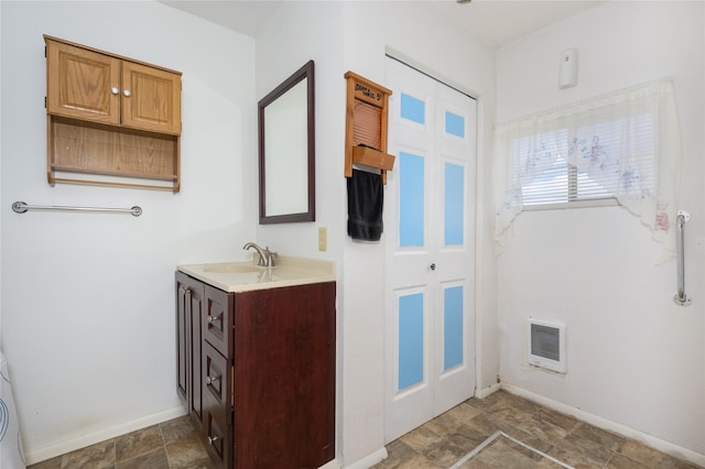 433 Swamp Creek Rd, Wise River, MT 59762 - bathroom with stone finish floor, baseboards, visible vents, and vanity