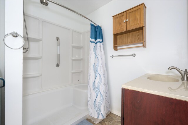 433 Swamp Creek Rd, Wise River, MT 59762 - full bathroom featuring baseboards, vanity, and curtained shower