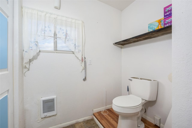 433 Swamp Creek Rd, Wise River, MT 59762 - bathroom featuring heating unit, toilet, and baseboards