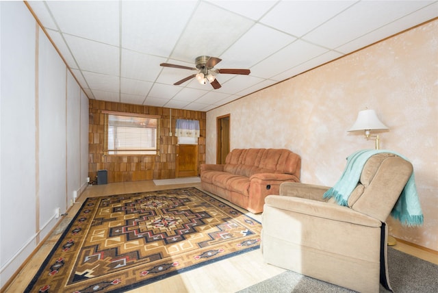 433 Swamp Creek Rd, Wise River, MT 59762 - living room featuring a drop ceiling, a ceiling fan, and wood finished floors