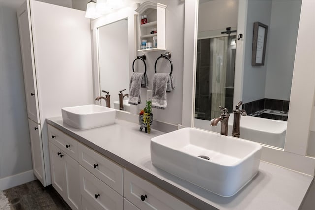 9 Ridge View Cir, Montana City, MT 59634 - full bathroom featuring double vanity and wood finished floors