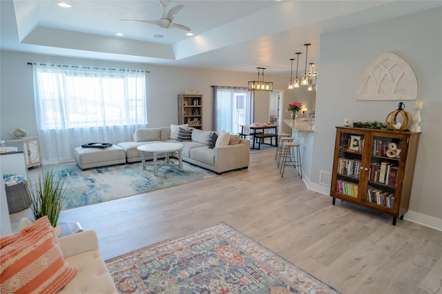 9 Ridge View Cir, Montana City, MT 59634 - living area featuring a tray ceiling, light wood finished floors, a ceiling fan, and recessed lighting