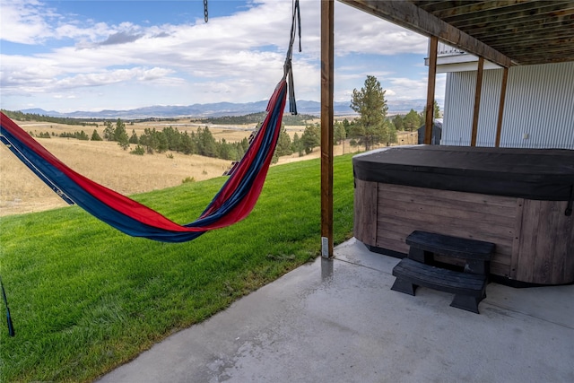 9 Ridge View Cir, Montana City, MT 59634 - view of patio with a hot tub and a mountain view