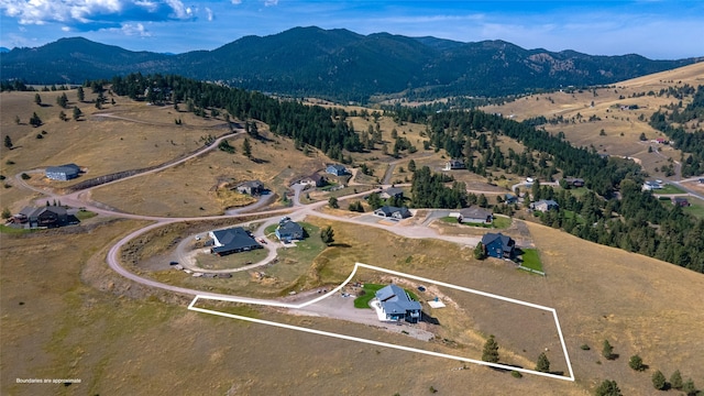 9 Ridge View Cir, Montana City, MT 59634 - aerial view of property's location featuring a mountain backdrop and property parcel outlined