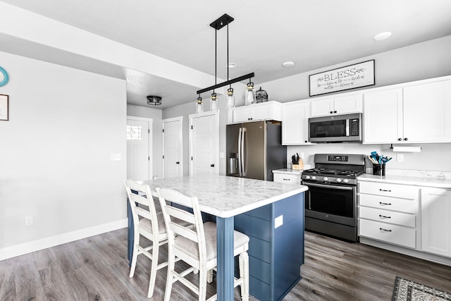 2009 Meriwether Ct, Great Falls, MT 59405 - kitchen with white cabinetry, stainless steel appliances, dark wood-type flooring, and a center island