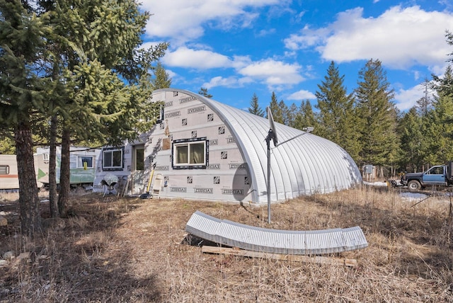 288 Mountain Meadow Rd, Kalispell, MT 59901 - rear view of property featuring a gambrel roof and a metal roof