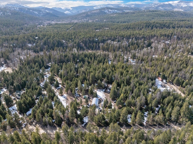 288 Mountain Meadow Rd, Kalispell, MT 59901 - aerial view of property and surrounding area with a heavily wooded area and mountains