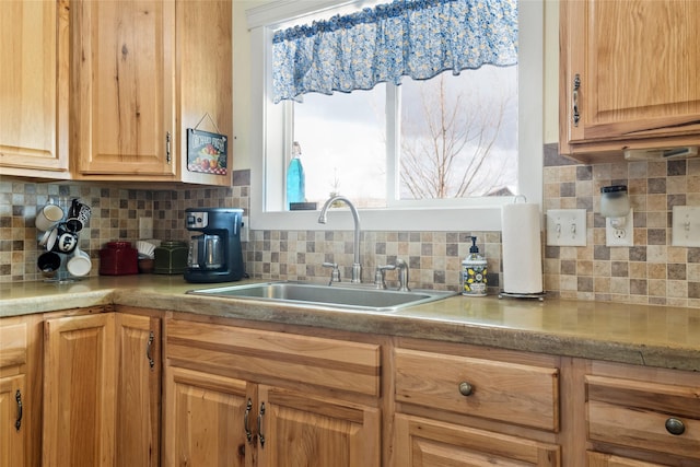 552 Pat Ln, Stevensville, MT 59870 - kitchen featuring backsplash, light countertops, and a sink