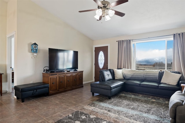 552 Pat Ln, Stevensville, MT 59870 - living area featuring baseboards, dark tile patterned flooring, high vaulted ceiling, and a ceiling fan