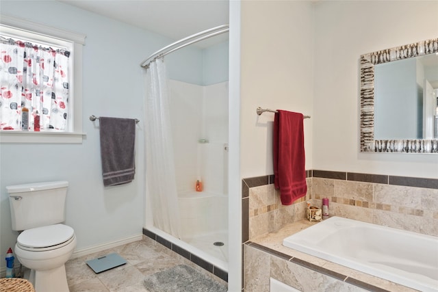 552 Pat Ln, Stevensville, MT 59870 - bathroom featuring a bath, baseboards, toilet, a stall shower, and tile patterned flooring