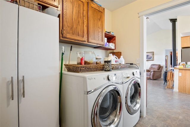 552 Pat Ln, Stevensville, MT 59870 - clothes washing area with washing machine and clothes dryer and cabinet space